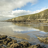 Buy canvas prints of Dunraven Bay with clouds reflected on wet sand by Nick Jenkins
