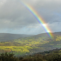 Buy canvas prints of A Rainbow and the Sugarloaf Brecon Beacons by Nick Jenkins