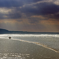 Buy canvas prints of Surfers on Rhossili Beach in Winter Gower by Nick Jenkins