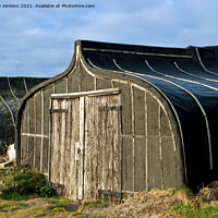 Buy canvas prints of Upturned Herring Boats now used as sheds on Lindis by Nick Jenkins