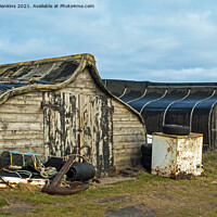 Buy canvas prints of Old Herring Boats now used as sheds on Lindisfarne by Nick Jenkins
