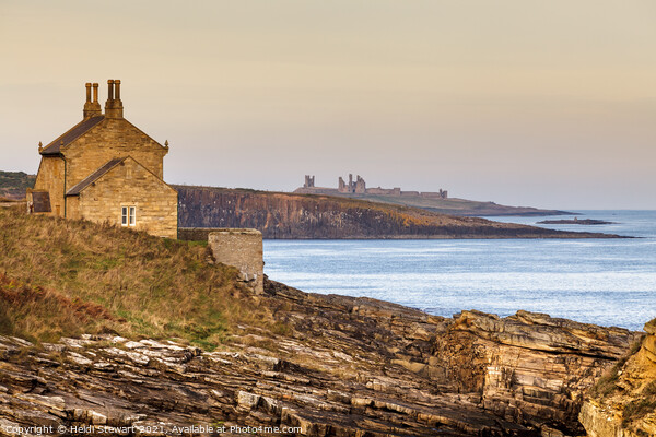 The Bathing House and Dunstanburgh Castle Picture Board by Heidi Stewart
