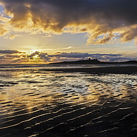 Buy canvas prints of Dunstanburgh Castle at Sunrise by Heidi Stewart