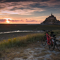 Buy canvas prints of Cycling at Mont St Michel, France by Richard Morgan