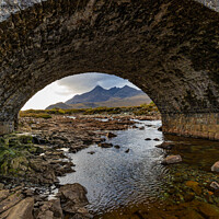 Buy canvas prints of Cuillin Mountains under the arch.  by Richard Morgan