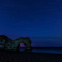 Buy canvas prints of Star Trails above Durdle Door by Anthony Simpson