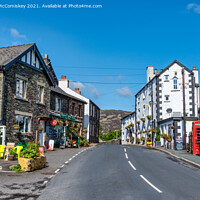 Buy canvas prints of Main street in Patterdale Village by Angus McComiskey