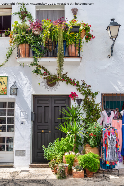 Floral display in Frigiliana in Andalusia, Spain Picture Board by Angus McComiskey
