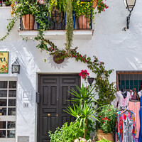 Buy canvas prints of Floral display in Frigiliana in Andalusia, Spain by Angus McComiskey