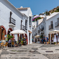 Buy canvas prints of Tourists in Frigiliana in Andalusia, Spain by Angus McComiskey