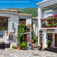 Buy canvas prints of Souvenir shops in Pampaneira in Andalusia, Spain by Angus McComiskey
