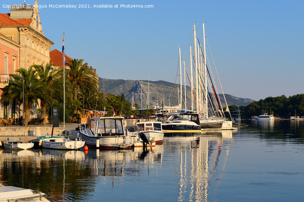 Early morning light Stari Grad harbour, Croatia Picture Board by Angus McComiskey