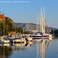 Buy canvas prints of Early morning light Stari Grad harbour, Croatia by Angus McComiskey