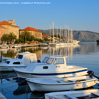 Buy canvas prints of Boats moored in Stari Grad harbour, Croatia by Angus McComiskey