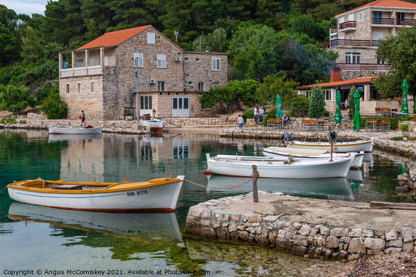 Boats tied up in Pomena harbour, Croatia Picture Board by Angus McComiskey