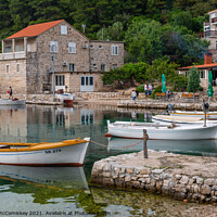 Buy canvas prints of Boats tied up in Pomena harbour, Croatia by Angus McComiskey