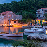 Buy canvas prints of Boats tied up in Pomena harbour at dusk, Croatia by Angus McComiskey