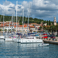 Buy canvas prints of Yachts moored in Vela Luka harbour, Croatia by Angus McComiskey