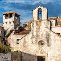 Buy canvas prints of Church of All Saints and Marco Polo Tower, Korcula by Angus McComiskey