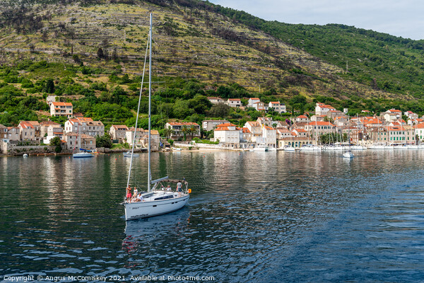 Yacht departing Vis Island, Croatia Picture Board by Angus McComiskey