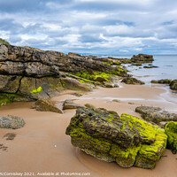 Buy canvas prints of Outcrop of rock on Dornoch beach in Sutherland by Angus McComiskey