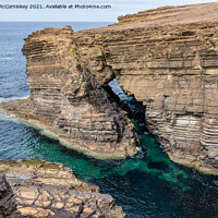 Buy canvas prints of Rock arch near Brough of Bigging, Orkney Mainland by Angus McComiskey