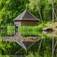 Buy canvas prints of Loch Dunmore boathouse in Faskally Forest by Angus McComiskey