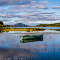 Buy canvas prints of Fisherman’s boat on Loch Peallach, Isle of Mull by Angus McComiskey