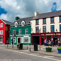 Buy canvas prints of Colourful buildings in Dingle Town, County Kerry by Angus McComiskey