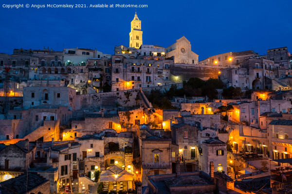View across Sassi District of Matera by night Picture Board by Angus McComiskey