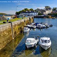 Buy canvas prints of Boats tied up in Roundstone harbour, County Galway by Angus McComiskey