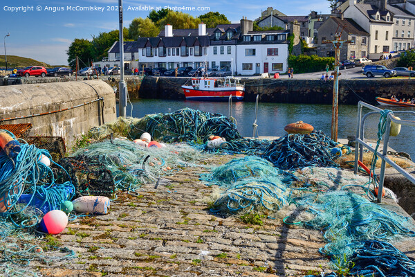 Fishing nets on Roundstone quayside, County Galway Picture Board by Angus McComiskey