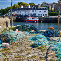 Buy canvas prints of Fishing nets on Roundstone quayside, County Galway by Angus McComiskey