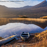 Buy canvas prints of Beached fishermen’s boats on Loch Lurgainn by Angus McComiskey