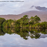Buy canvas prints of Loch Cul Dromannan reflections, Coigach Peninsula by Angus McComiskey