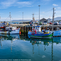 Buy canvas prints of Fishing boats in Stromness harbour, Orkney Isles by Angus McComiskey