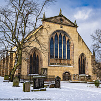 Buy canvas prints of Greyfriars Kirk and Kirkyard in snow, Edinburgh by Angus McComiskey