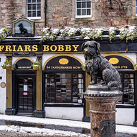 Buy canvas prints of Statue of Greyfriars Bobby in snow, Edinburgh by Angus McComiskey