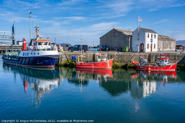 Boats on quayside at Stromness harbour in Orkney Picture Board by Angus McComiskey