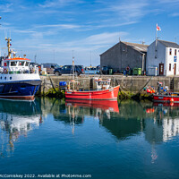 Buy canvas prints of Boats on quayside at Stromness harbour in Orkney by Angus McComiskey