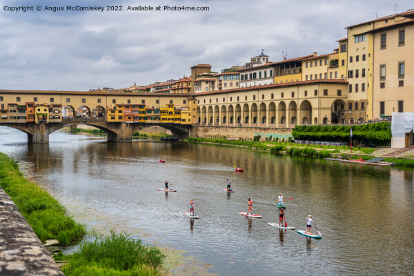 Paddle boarders on the Arno in Florence, Tuscany Picture Board by Angus McComiskey