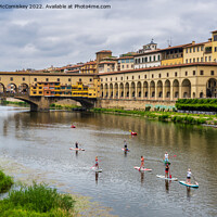 Buy canvas prints of Paddle boarders on the Arno in Florence, Tuscany by Angus McComiskey