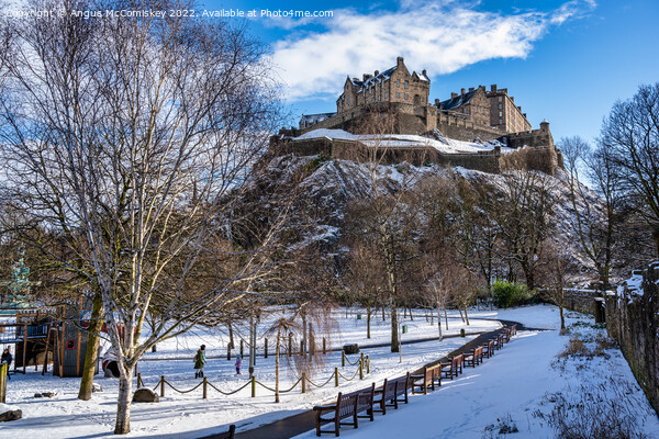 Edinburgh Castle snow from Princes Street Gardens Picture Board by Angus McComiskey
