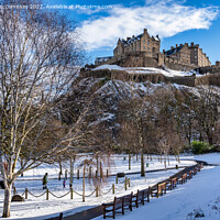 Buy canvas prints of Edinburgh Castle snow from Princes Street Gardens by Angus McComiskey