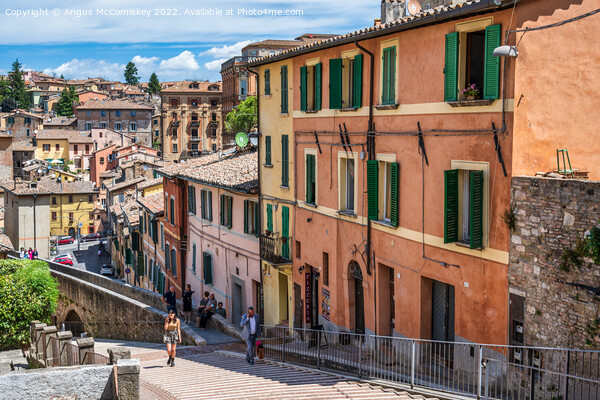 Colourful buildings beside the aqueduct in Perugia Picture Board by Angus McComiskey