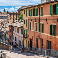 Buy canvas prints of Colourful buildings beside the aqueduct in Perugia by Angus McComiskey