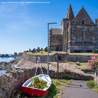 Buy canvas prints of St Monans Parish Church and floral boat by Angus McComiskey