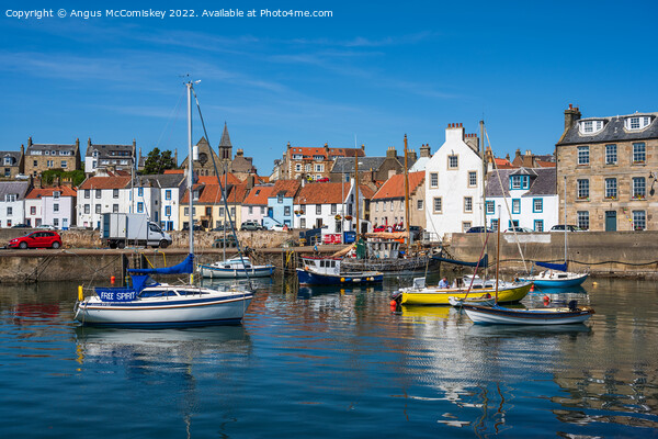 Boats moored in St Monans harbour Picture Board by Angus McComiskey