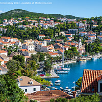 Buy canvas prints of Looking down on Cavtat harbour in Croatia by Angus McComiskey