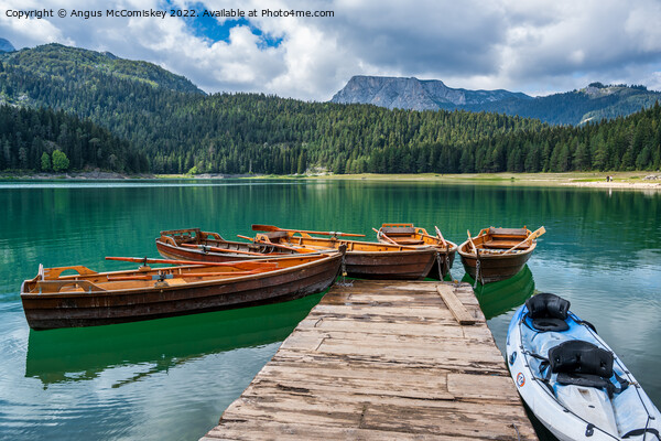 Rowing boats on the Black Lake in Montenegro Picture Board by Angus McComiskey
